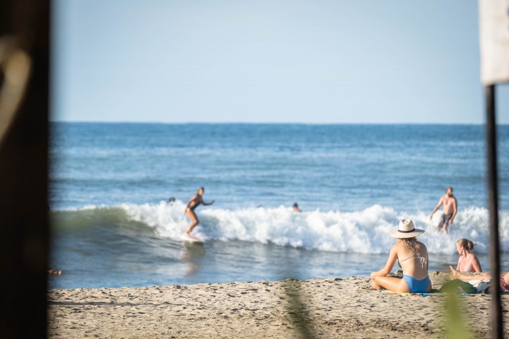 Woman surfing in Sayulita Mexico Sustainable surfer girl Susan Paige Photography