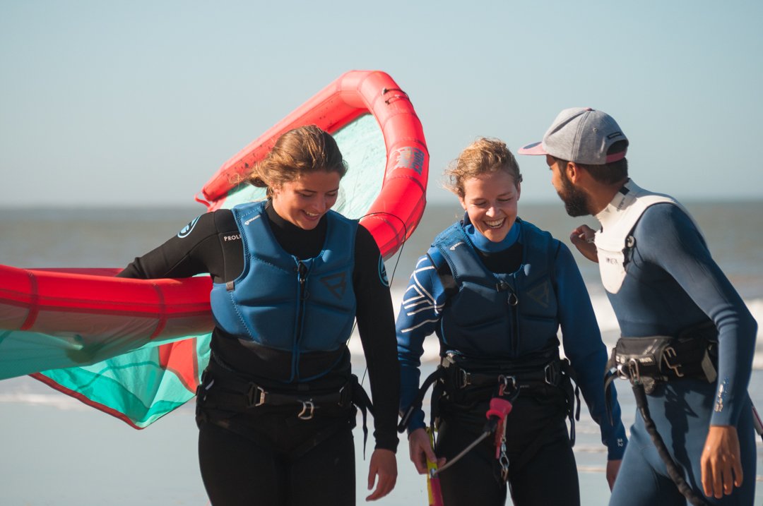 Friends Laughing post kitesurf session in Essaouira with Loving surf camp package