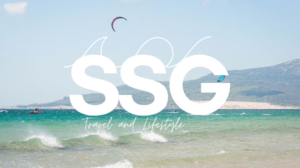SSG Travel & Lifestyle logo over kitesurfing in Tarifa ocean