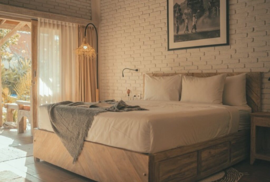 Bali style decor Bedroom in Villa at Cari surf camp Bali with ambient lighting