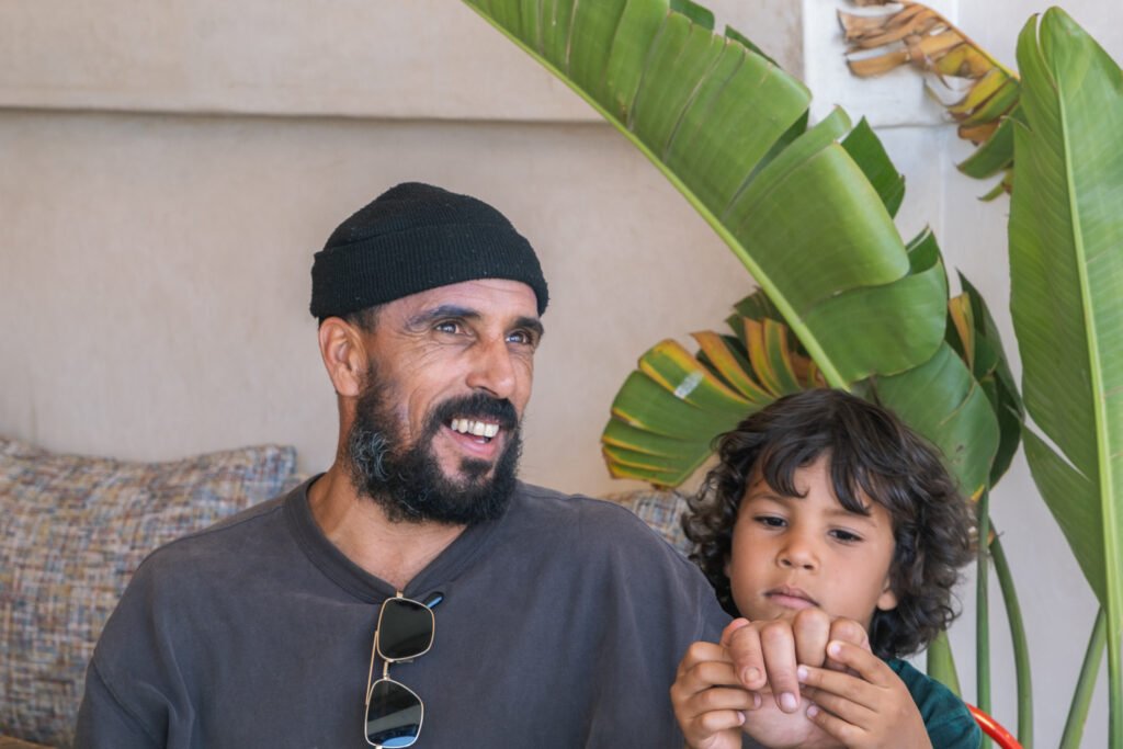 Kite Maroc owner Majid with son at Sunset Mogador in Essaouira, Morocco