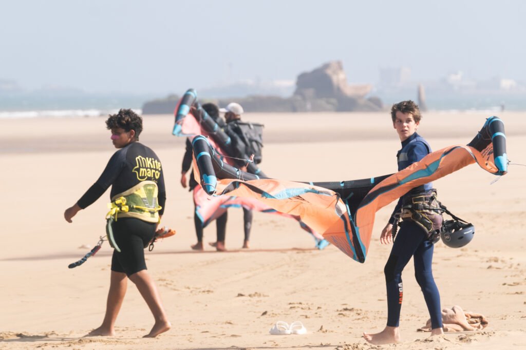 Group o family kite students after their group kite lesson in Essaouira Morocco with Kite Maroc kite and surf school