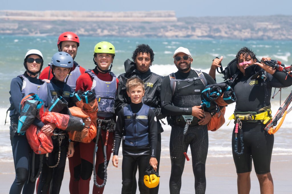 Group o family kite students after their group kite lesson in Essaouira Morocco with Kite Maroc kite and surf school