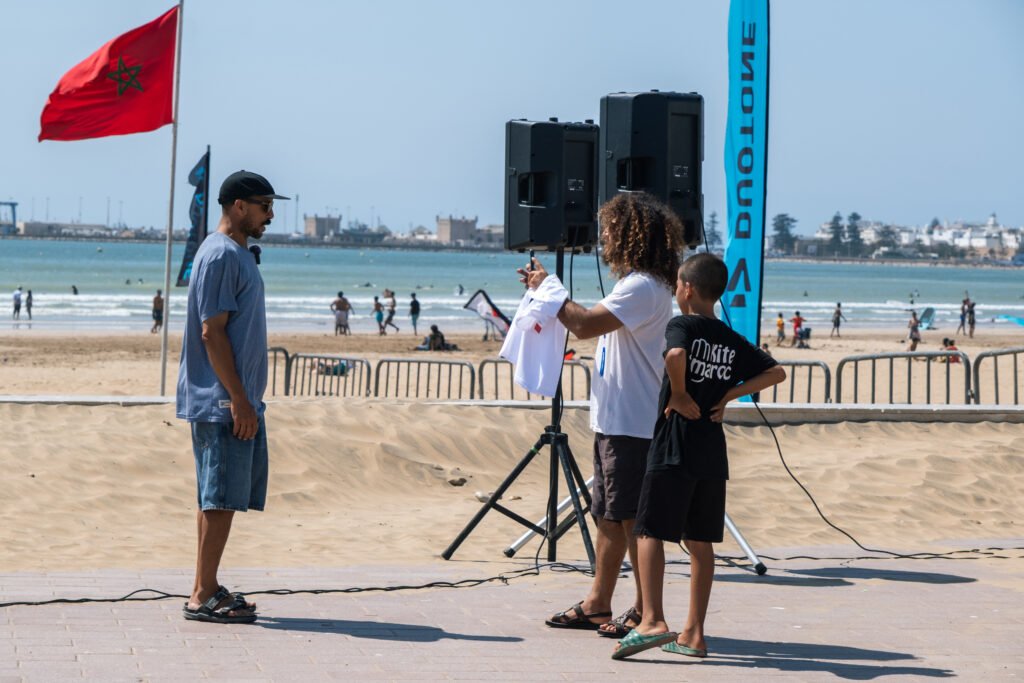Majid being interviewed for video at kitesurf competition at Essaouira beach in Morocco