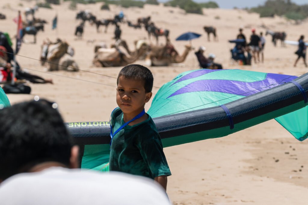 asma, soulymane and medhi from Kite Maroc at kitesurf competition at Essaouira beach in Morocco for association juene essaouira sports nautique